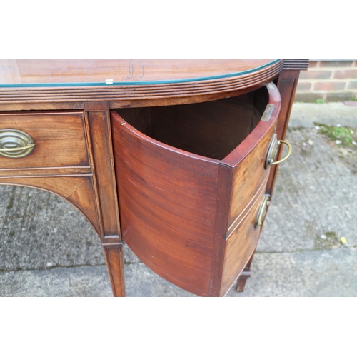 452 - A George III mahogany break bowfront sideboard, fitted cupboard, centre drawer and cellarette (no li... 