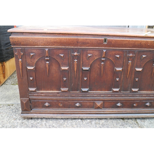 455 - An early 18th century oak mule chest with applied mouldings and arcaded front over one long drawer a... 