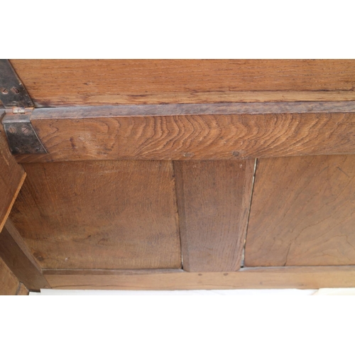 455 - An early 18th century oak mule chest with applied mouldings and arcaded front over one long drawer a... 