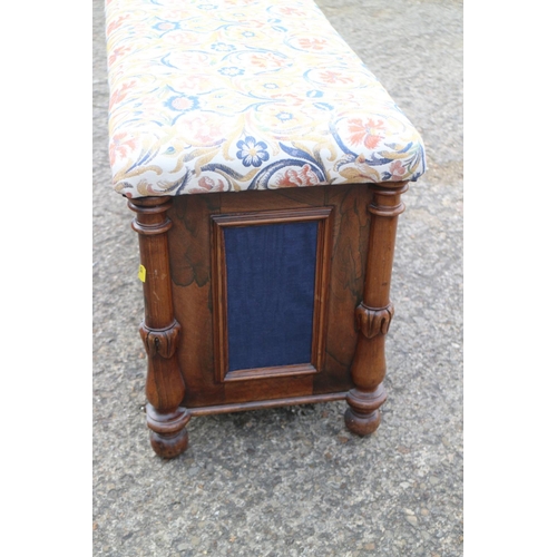 456 - A Regency rosewood box seat ottoman with fabric panels, on turned and castored supports, 34