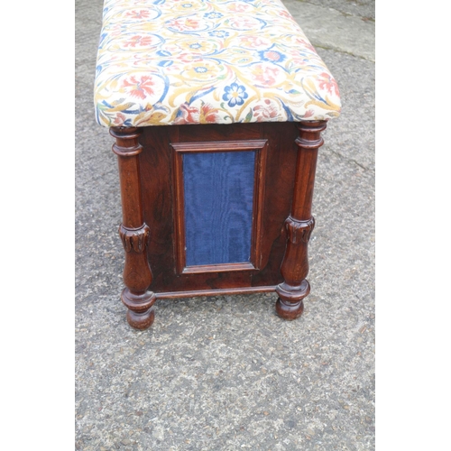 456 - A Regency rosewood box seat ottoman with fabric panels, on turned and castored supports, 34