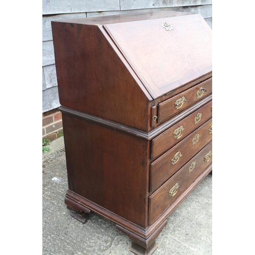 458 - A mid 18th century mahogany two-section fall front bureau, the interior fitted drawers and pigeon ho... 