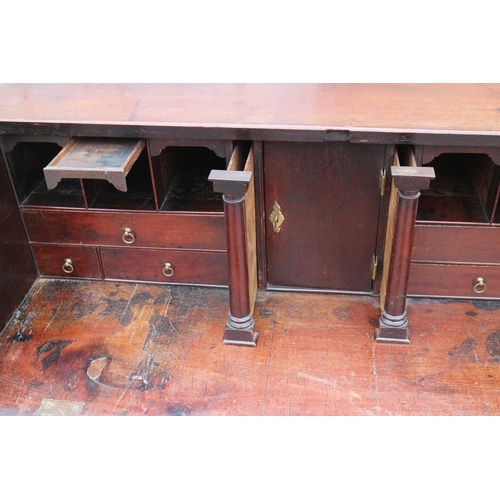 458 - A mid 18th century mahogany two-section fall front bureau, the interior fitted drawers and pigeon ho... 