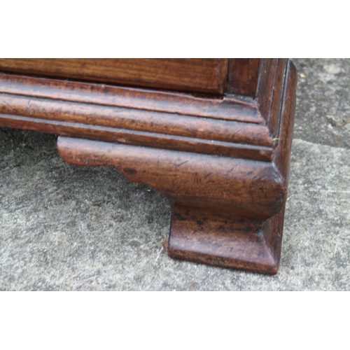 458 - A mid 18th century mahogany two-section fall front bureau, the interior fitted drawers and pigeon ho... 