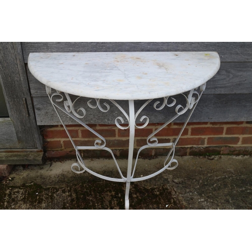 A wrought iron and marble top semicircular console table, 36