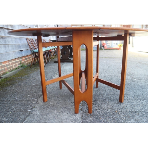 499 - A 1960s oak deep drop leaf oval dining table, 60