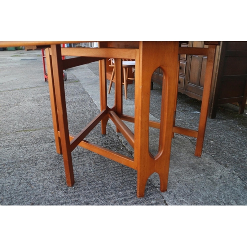 499 - A 1960s oak deep drop leaf oval dining table, 60