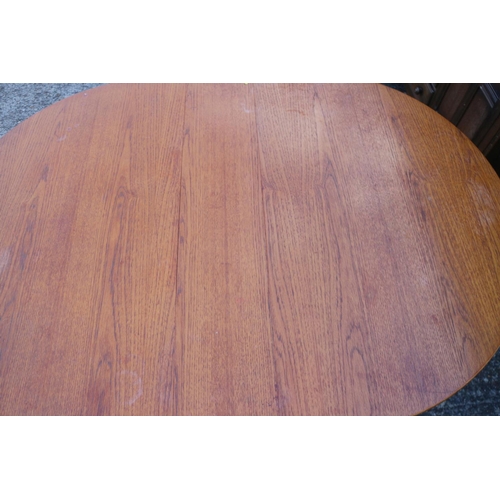 499 - A 1960s oak deep drop leaf oval dining table, 60