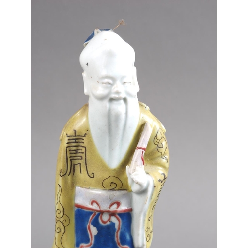 82 - A Chinese polychrome enamel decorated figure, 8