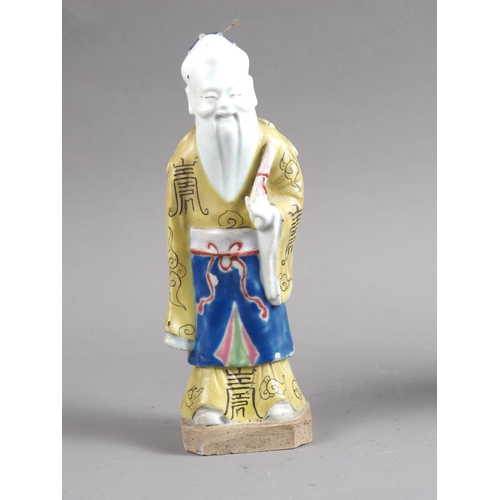 82 - A Chinese polychrome enamel decorated figure, 8