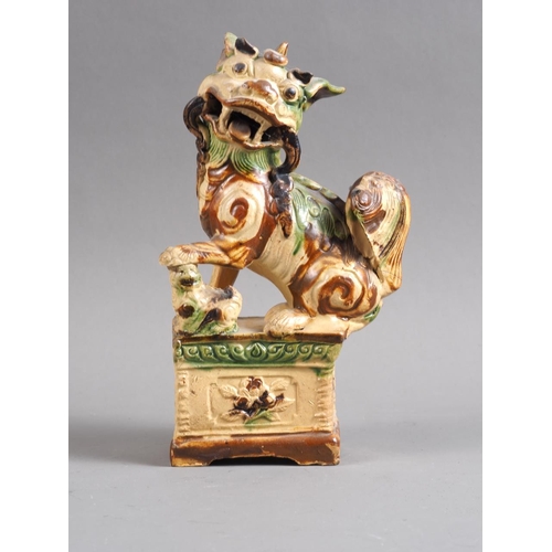 82 - A Chinese polychrome enamel decorated figure, 8