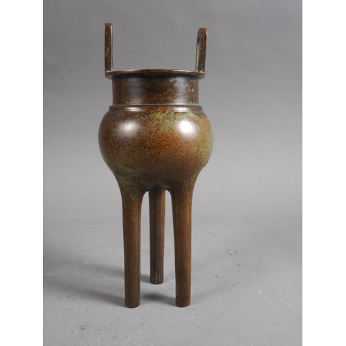 90 - A Chinese bronze censor, formed as a cauldron, on three cylindrical supports, 7