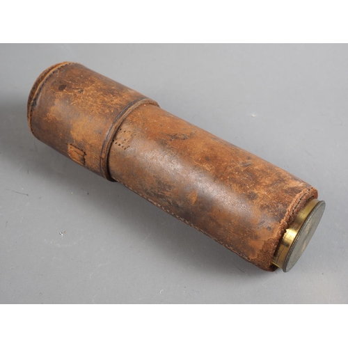 100 - An officer's early 19th century brass and mahogany three-draw telescope, in leather case, said to ha... 