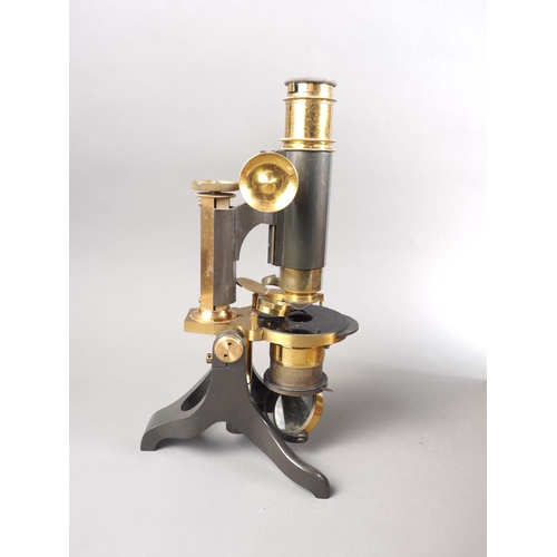 101 - A 19th century brass microscope, in mahogany case