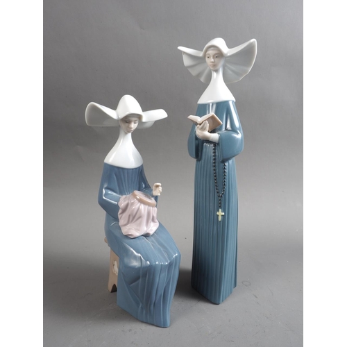 11 - Two Lladro nuns, a Lladro swan, a Hummel figure of a baker, a coronation mug and an Aynsley posy bow... 