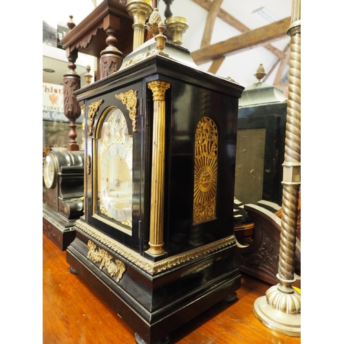 111 - An ebonised and gilt metal mounted bracket clock with eight-day striking and chiming movement on eig... 