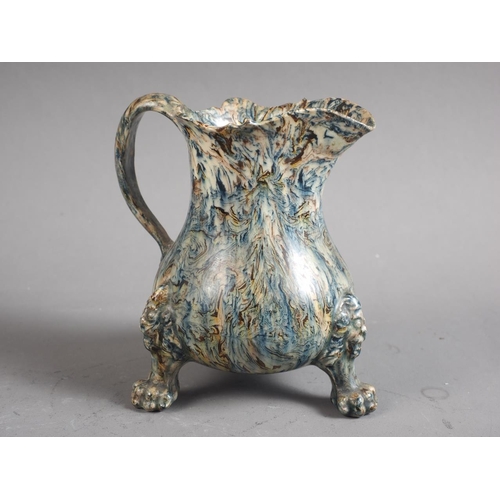 12 - A mid 18th century agate ware cream jug, on lion mask and paw feet, 4