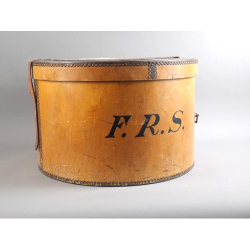 162 - An early 20th century wooden hat box, an early 20th century silk top hat, a boater, etc