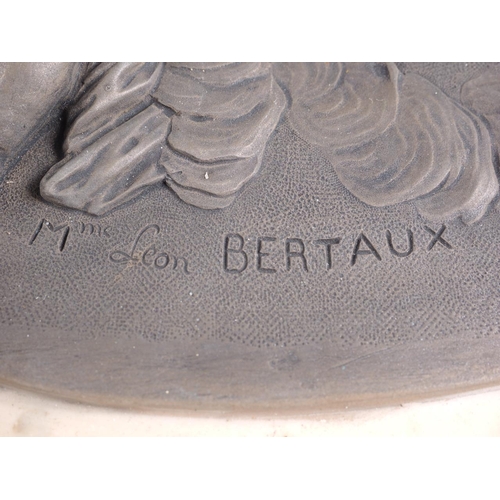 169 - After Leon Bertaux: a pair of oval relief moulded resin plaques with putti design, 16