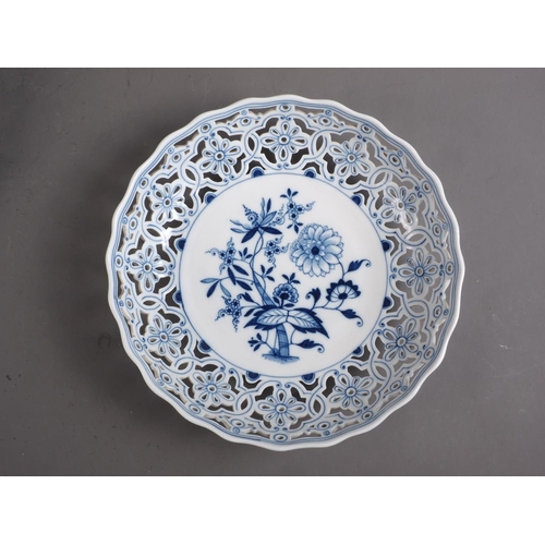 4 - A pair of Meissen porcelain blue and white reticulated dishes with floral decoration, 10 1/2