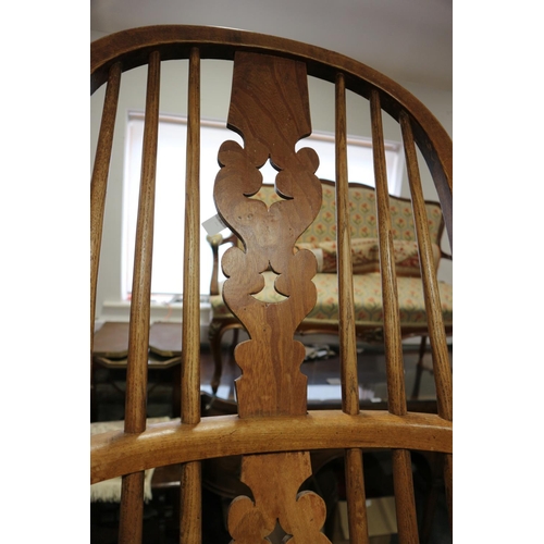 411 - A Lancashire oak, ash and elm elbow chair with panel seat, on turned and stretchered supports