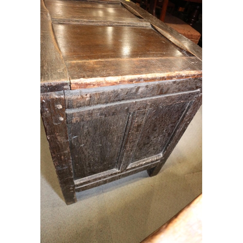 418 - An early 18th century quarter cut oak triple panel front coffer, on moulded stile supports, 45 1/2