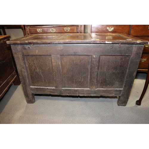 418 - An early 18th century quarter cut oak triple panel front coffer, on moulded stile supports, 45 1/2