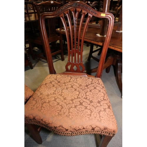 443 - A pair of Georgian mahogany hump back dining chairs of Hepplewhite design with serpentine stuffed ov... 