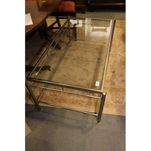 526 - A brushed chrome framed glass top coffee table, 44