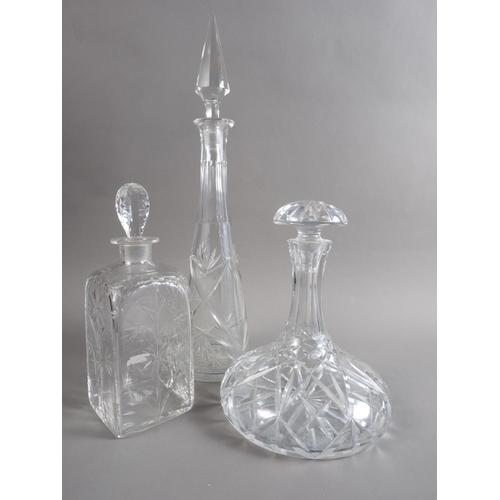 58 - A ship's cut glass decanter, a spirit decanter and one other decanter and stopper