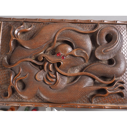 91 - A Chinese carved wooden box with dragon decoration, containing various curios, and a Chinese hardwoo... 