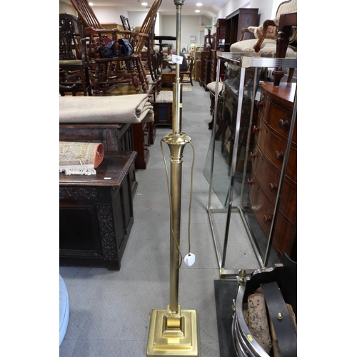 192 - A reeded brass adjustable standard lamp, on square base, 59