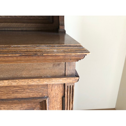 490 - An early 20th century oak bookcase with open shelves over cupboards, on block base, 50