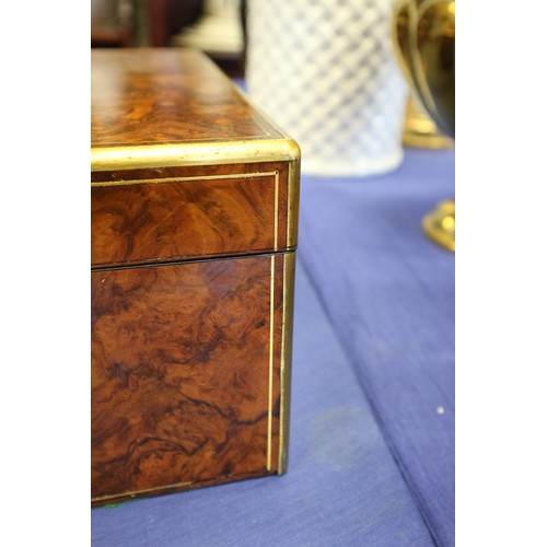 137 - A 19th century burr walnut and brass mounted writing box with fitted interior and three 