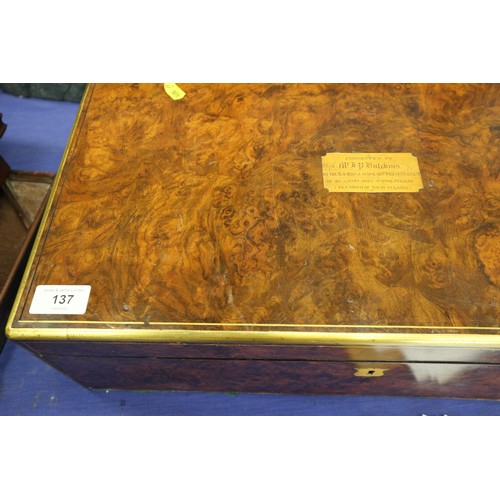 137 - A 19th century burr walnut and brass mounted writing box with fitted interior and three 