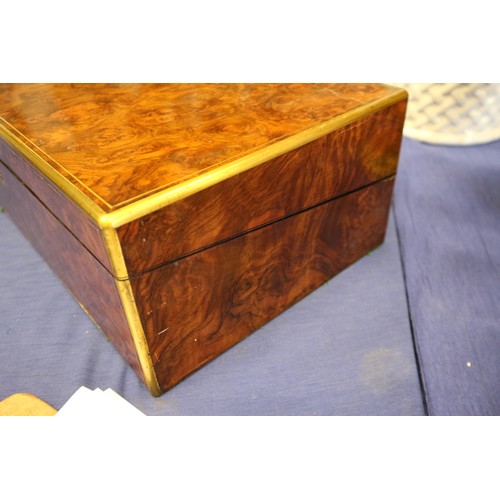 137 - A 19th century burr walnut and brass mounted writing box with fitted interior and three 