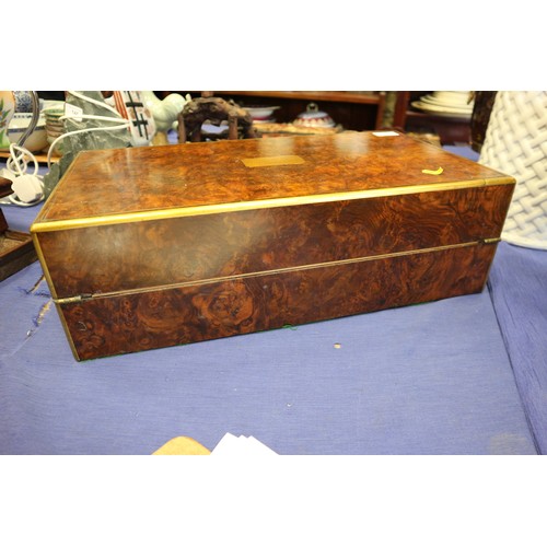 137 - A 19th century burr walnut and brass mounted writing box with fitted interior and three 