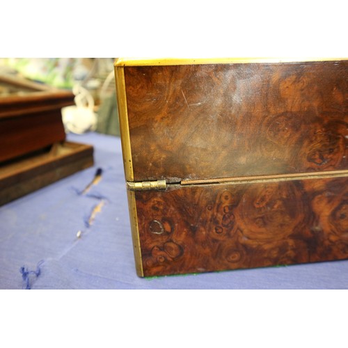 137 - A 19th century burr walnut and brass mounted writing box with fitted interior and three 