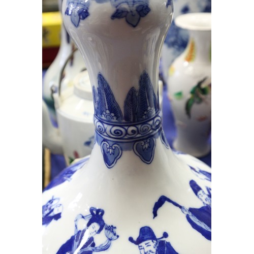 205 - A pair of Chinese blue and white bulbous figure decorated vases, now table lamps, on hardwood bases,... 