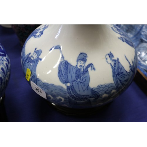 205 - A pair of Chinese blue and white bulbous figure decorated vases, now table lamps, on hardwood bases,... 