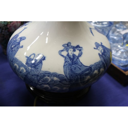 205 - A pair of Chinese blue and white bulbous figure decorated vases, now table lamps, on hardwood bases,... 