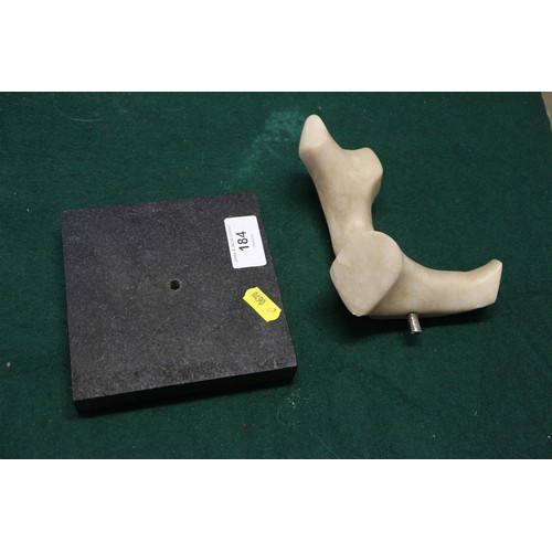 184 - A modern abstract alabaster figure, on square base, 6 1/2