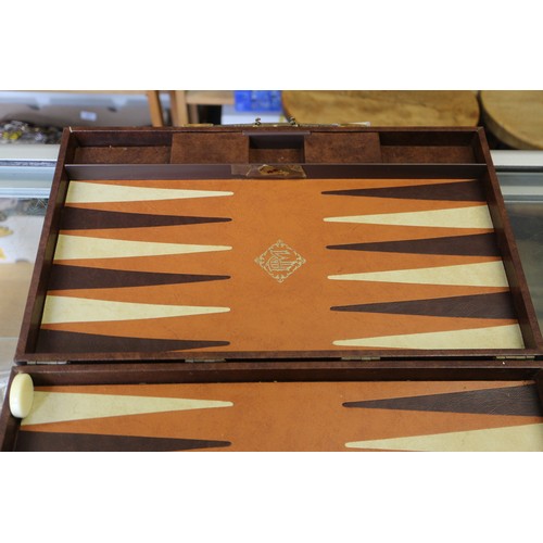 152 - Two backgammon sets, in leather travel cases and a clown