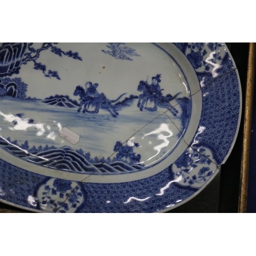 73 - A Chinese blue and white jardiniere with figures in a landscape, 9 1/2