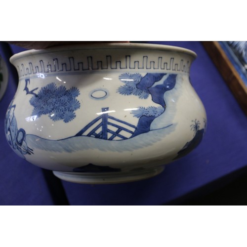 73 - A Chinese blue and white jardiniere with figures in a landscape, 9 1/2