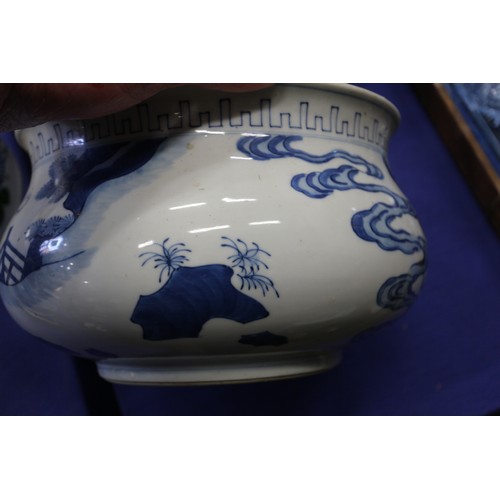 73 - A Chinese blue and white jardiniere with figures in a landscape, 9 1/2