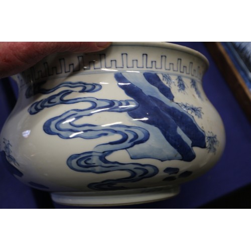 73 - A Chinese blue and white jardiniere with figures in a landscape, 9 1/2