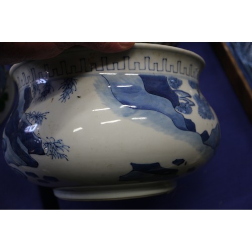 73 - A Chinese blue and white jardiniere with figures in a landscape, 9 1/2