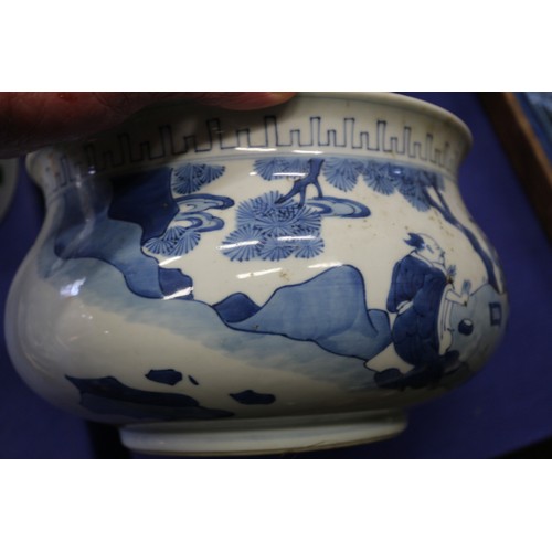 73 - A Chinese blue and white jardiniere with figures in a landscape, 9 1/2