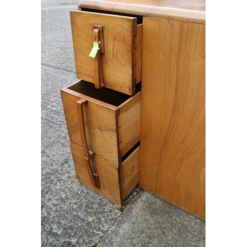 543 - A 1930s walnut metamorphic cube desk, fitted three doors, concealed kneehole and three open corner s... 